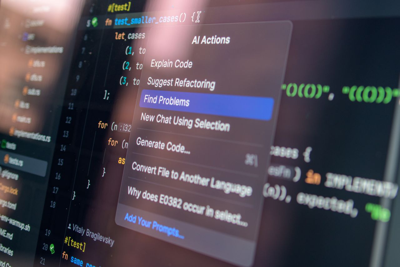 team-03 Close-up of AI-assisted coding with menu options for debugging and problem-solving.